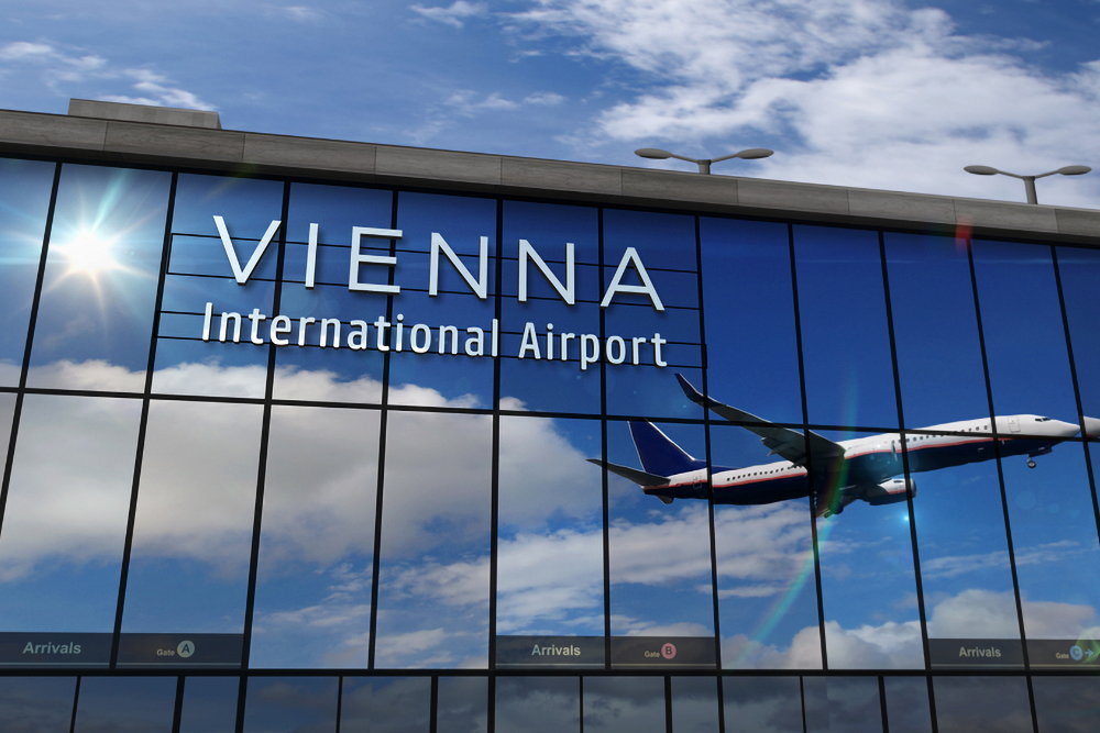 Jet aircraft landing at Vienna, Austria 3D rendering illustration. Arrival in the city with the glass airport terminal and reflection of the plane. Travel, business, tourism and transport concept.